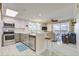Modern kitchen with stainless steel appliances, granite countertops, and a breakfast bar at 13415 Blue Heron Beach Dr # 1201, Orlando, FL 32821