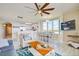 Open-concept living room featuring modern furniture and a seamless flow to the kitchen and dining areas at 13415 Blue Heron Beach Dr # 1201, Orlando, FL 32821