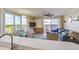 Bright, open living space with floor-to-ceiling windows and sliding doors offering expansive views at 13415 Blue Heron Beach Dr # 1201, Orlando, FL 32821