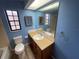 A well-lit bathroom with ample mirror space and functional fixtures at 669 Eagle Run, Lakeland, FL 33809