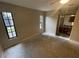 Bedroom with ensuite bathroom and natural light at 669 Eagle Run, Lakeland, FL 33809