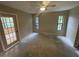 Well-lit bedroom with large windows and access to outside at 669 Eagle Run, Lakeland, FL 33809