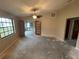 Bedroom with ceiling fan and double french doors leading to enclosed patio at 669 Eagle Run, Lakeland, FL 33809