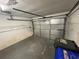 Inside a standard, single-car garage with a visible garage door opener at 669 Eagle Run, Lakeland, FL 33809