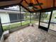 A screened-in patio with brick flooring and a ceiling fan at 669 Eagle Run, Lakeland, FL 33809