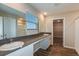 Modern bathroom featuring a double sink vanity, mirror, and wood-style flooring at 1014 Foreshore Ln, Haines City, FL 33844
