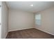 Neutral bedroom with a window providing natural light and plush carpeting at 1014 Foreshore Ln, Haines City, FL 33844