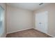 Cozy bedroom featuring carpet, closet and a bright window allowing for ample natural light at 1014 Foreshore Ln, Haines City, FL 33844