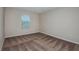 Bedroom featuring plush carpet, neutral walls and a bright window allowing for ample light at 1014 Foreshore Ln, Haines City, FL 33844