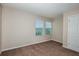 This bedroom features plush carpet, neutral walls, closet and dual windows allowing natural light at 1014 Foreshore Ln, Haines City, FL 33844