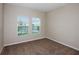 Bright bedroom with neutral walls, plush carpeting, and bright, sunlit windows at 1014 Foreshore Ln, Haines City, FL 33844