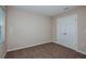 Bright, carpeted bedroom with closet and window allowing natural light at 1014 Foreshore Ln, Haines City, FL 33844