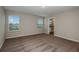 Bright bedroom with neutral walls, carpet, and access to a bathroom and walk-in closet at 1014 Foreshore Ln, Haines City, FL 33844