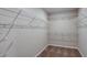 Spacious walk-in closet with built-in wire shelving for ample storage and organization at 1014 Foreshore Ln, Haines City, FL 33844