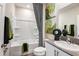 Clean bathroom featuring a bathtub and shower, sink with counter space, contemporary art, and modern fixtures at 1612 Ellesmere Ave, Haines City, FL 33844