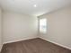 Carpeted bedroom with a light color scheme and natural light from the window at 4063 Gardenia Ave, Lake Hamilton, FL 33851