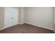 Bedroom features neutral walls, carpet, and a double-door closet at 4063 Gardenia Ave, Lake Hamilton, FL 33851