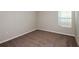 Neutral bedroom featuring a light beige color palette and plush brown carpeting at 4063 Gardenia Ave, Lake Hamilton, FL 33851