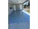 Spacious covered patio area with painted floor, providing an ideal outdoor living space at 122 2Nd Jpv St, Winter Haven, FL 33880