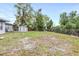 A backyard with a shed and chain link fence at 122 2Nd Jpv St, Winter Haven, FL 33880