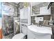 Bathroom featuring gray-veined tile, a white vanity, and a modern toilet at 122 2Nd Jpv St, Winter Haven, FL 33880