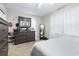 Bedroom featuring a dark wood dresser, carpet and large bright window at 122 2Nd Jpv St, Winter Haven, FL 33880
