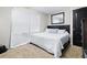 Bedroom featuring neutral walls, carpet, and a bed with a patterned comforter and decorative pillows at 122 2Nd Jpv St, Winter Haven, FL 33880
