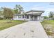 Charming single-story home with a covered carport and well-maintained front yard at 122 2Nd Jpv St, Winter Haven, FL 33880