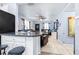 Spacious living room with tile flooring, ceiling fan, and an adjacent kitchen area at 122 2Nd Jpv St, Winter Haven, FL 33880