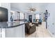 Open-concept living room with a bar top, tile floors, and ample space for entertaining at 122 2Nd Jpv St, Winter Haven, FL 33880