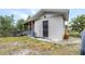 Exterior view of a storage shed with a dark-colored door at 122 2Nd Jpv St, Winter Haven, FL 33880