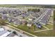 Community aerial view with neatly arranged homes, green areas, and convenient access to nearby schools and roadways at 1773 Yellow Trl, Lakeland, FL 33801