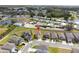 Residential aerial view of the home surrounded by a mix of housing and a pond, highlighting the community layout at 1773 Yellow Trl, Lakeland, FL 33801