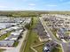 Scenic aerial view showcases the home's location within a community with ponds and easy access to main roadways at 1773 Yellow Trl, Lakeland, FL 33801