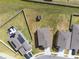 Aerial view of neighborhood showcasing backyards with playhouse and solar panels at 1773 Yellow Trl, Lakeland, FL 33801