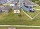 Aerial view of neighborhood showcasing backyard with playground at 1773 Yellow Trl, Lakeland, FL 33801