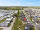 Residential aerial view featuring a home in a well-planned community with a nearby lake and mature trees at 1773 Yellow Trl, Lakeland, FL 33801