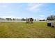 Backyard with shed, fenced in lawn and A/C unit at 1773 Yellow Trl, Lakeland, FL 33801