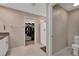 Bathroom featuring a toilet, granite vanity, tile floors, and a combined shower and walk-in closet at 1773 Yellow Trl, Lakeland, FL 33801