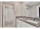 Bathroom featuring double sinks with granite counters and tile flooring at 1773 Yellow Trl, Lakeland, FL 33801