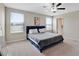 A well-lit bedroom with a plush bed, large windows, and neutral color scheme at 1773 Yellow Trl, Lakeland, FL 33801