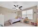bedroom featuring a ceiling fan and a window, designed for comfort and play at 1773 Yellow Trl, Lakeland, FL 33801