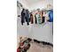 Walk-in closet featuring shelving with clothes, shoes and various personal items at 1773 Yellow Trl, Lakeland, FL 33801