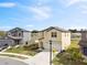 Front view highlights a two-story home with a modern design, manicured landscaping, and a spacious driveway at 1773 Yellow Trl, Lakeland, FL 33801