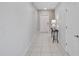 View of tiled foyer, staircase and decorative table with a lamp at 1773 Yellow Trl, Lakeland, FL 33801
