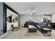 Modern living room featuring a large leather sectional sofa and tile floors at 1773 Yellow Trl, Lakeland, FL 33801