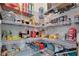 A well-organized walk-in pantry with wire shelving full of food and household items at 1773 Yellow Trl, Lakeland, FL 33801