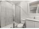 Contemporary bathroom with glass-enclosed shower, modern fixtures, and neutral tile at 1786 White Elephant Loop, Winter Haven, FL 33884