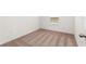 Simple bedroom with neutral carpet, white walls, and a window with blinds at 1786 White Elephant Loop, Winter Haven, FL 33884