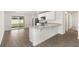 Modern kitchen with stainless steel appliances, granite countertops, and a view of the backyard at 1786 White Elephant Loop, Winter Haven, FL 33884